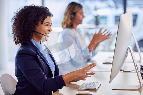 Image of Contact us, call center or happy woman by computer explaining in communications company office. Friendly smile, crm worker or telemarketing sales agent talking online in telecom customer support