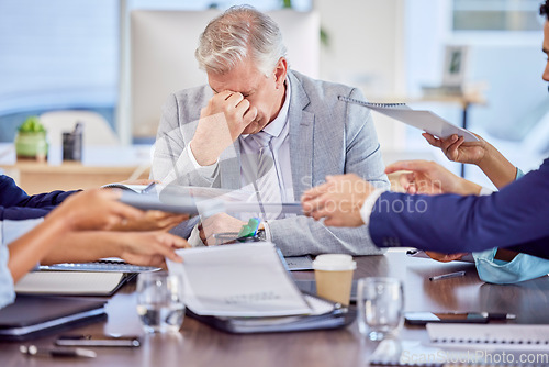 Image of Businessman in meeting with headache, burnout or stress with mental health emergency in work office. Senior company manager with anxiety, sick and frustrated with migraine pains, problems or fatigue