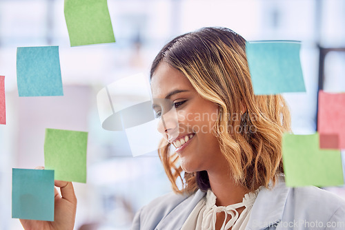 Image of Planning, brainstorming and woman writing on glass board for project management, workflow and job schedule. Creative worker or indian person with sticky note ideas for career strategy or goals