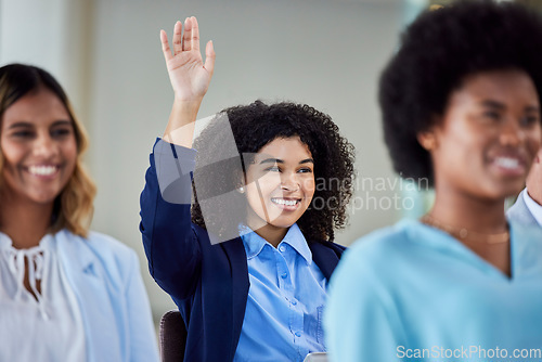 Image of Business woman, presentation and question for idea, answer or FAQ in team meeting from audience in seminar. Female employee with hands raised in staff training, planning or strategy in crowd workshop