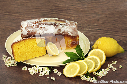 Image of Homemade Lemon Drizzle Cake with Spring Blossom Flowers