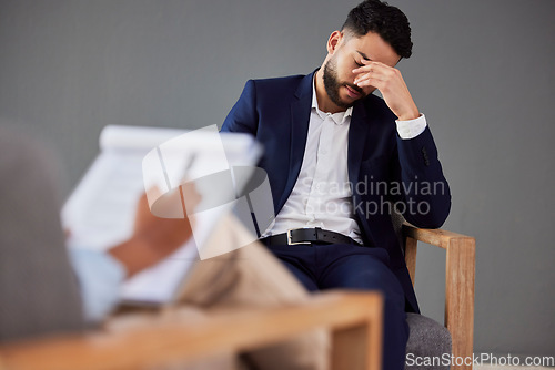 Image of Sad man consulting therapist in therapy, psychology or counseling for mental health, debt or career stress support. Checklist, evaluation and psychologist with business person or patient consultation