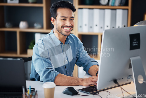 Image of Computer, typing and business man in office working online for information technology, internet or global digital company. Happy Asian person or worker on desktop pc for professional market research