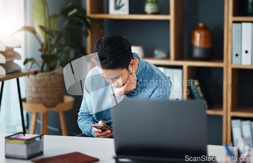 Image of Bored, phone and businessman in his office networking on social media, mobile app or the internet. Technology, professional and tired male employee browsing on a website with a cellphone in workplace
