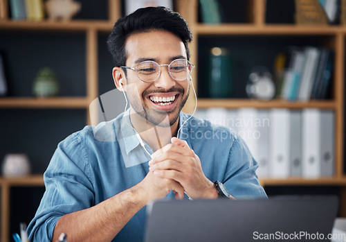 Image of Happy asian man, laptop and smile on video call for communication with earphones at the office desk. Male employee smiling for webinar, virtual meeting or networking on computer at the workplace