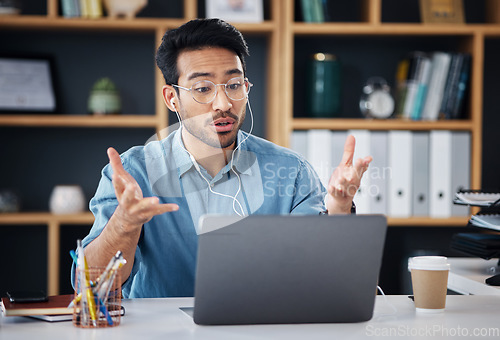 Image of Asian man, laptop and consulting in video call for communication with earphones at office desk. Male employee talking or explaining in webinar, virtual meeting or networking on computer at workplace