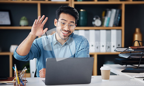 Image of Happy asian man, laptop and smile for video call, social media or communication at office desk. Male creative designer smiling and waving for webinar, meeting or networking on computer at workplace
