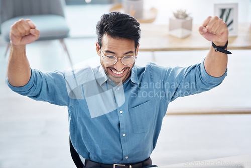 Image of Winner, success and happy businessman in office, celebrating and excited for email, review or loan approval. Hands, celebration and corporate male online winner with emoji, wow or winning gesture