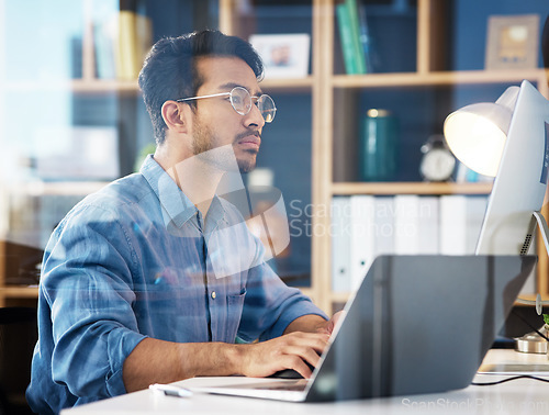 Image of Serious, business man typing on laptop, computer and software development, online research or information technology. App developer or asian person on digital multimedia and office glass reflection