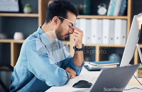 Image of Stress, headache and tired man on computer with career burnout, anxiety or mental health risk in office. Sad business man with depression, migraine and anxiety for online job mistake, fail or fatigue