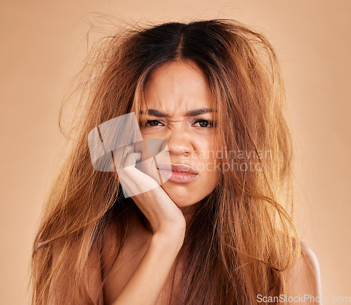 Image of Face portrait, hair loss and sad woman in studio isolated on a brown background. Salon, keratin damage and angry female model with haircare problem, messy hairstyle or split ends after treatment fail