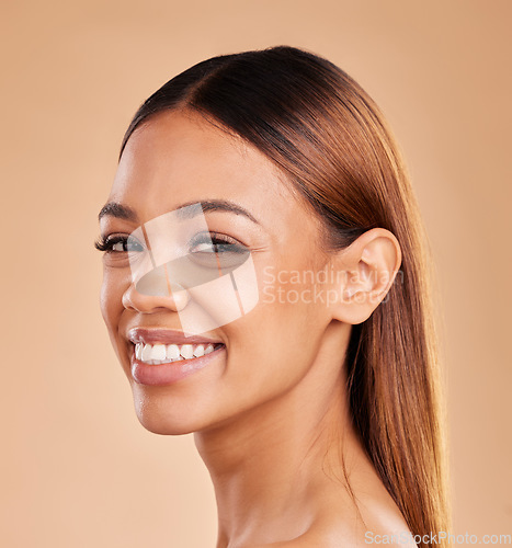 Image of Woman, beauty and hair care portrait with a smile for growth and shine shampoo on a brown background. Happy female face in studio for natural keratin treatment and wellness with skincare