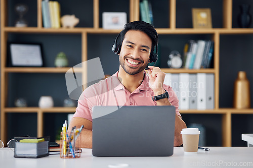 Image of Happy asian man, call center and smile on laptop for consulting, customer service or support at office desk. Portrait of male consultant with headphones by computer for telemarketing or online advice