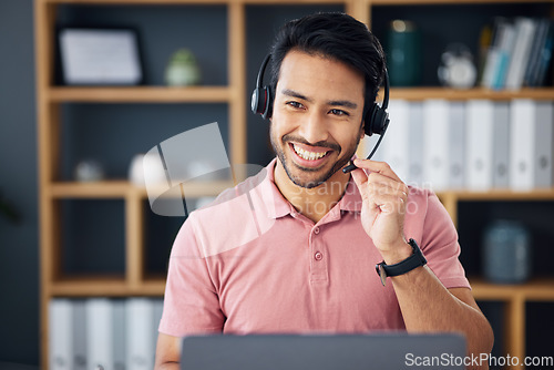 Image of Asian man, call center and headset on laptop with smile for consulting, customer service or support at office. Happy male consultant with headphones by computer for telemarketing or online advice