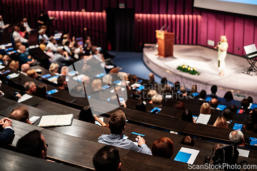 Image of Woman giving presentation on business conference event.