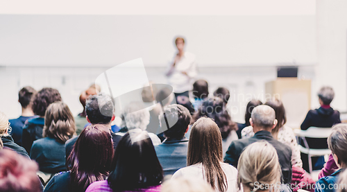 Image of Woman giving presentation on business conference event.