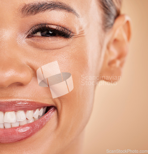 Image of Happy, portrait and closeup of woman in studio for makeup, cosmetic and skincare on brown background. Smile, face and zoom on girl excited for beauty, treatment or dermatology, smiling and isolated