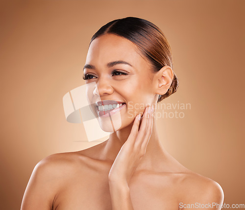 Image of Skincare, natural beauty smile and woman with soft skin from facial and dermatology. Self care, isolated and studio background with a young model feeling face after spa and cosmetics treatment