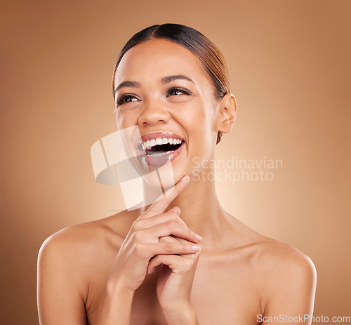 Image of Skincare, beauty and woman laughing with soft skin from facial and dermatology. Self care, isolated and studio background with a young model feeling face texture after spa and cosmetics treatment