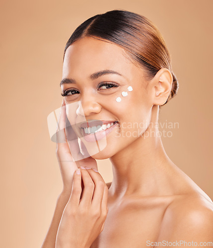 Image of Face portrait, skincare and woman with cream in studio isolated on a brown background. Dermatology, beauty cosmetics and happy female model with lotion, creme or facial moisturizer of skin health.