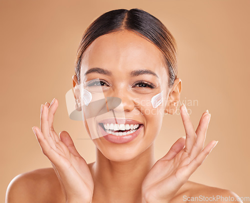 Image of Face, funny skincare and woman with cream in studio isolated on a brown background. Cosmetics, laughing and portrait of happy female model with lotion, creme or facial moisturizer for skin health.