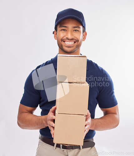 Image of Delivery man portrait, shipping export and box of a employee in studio with courier service and a smile. Boxes, supply chain and happiness of a worker with online shopping, mail services and parcel