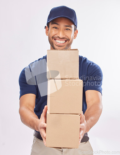 Image of Delivery man, shipping boxes and portrait of a employee in studio with courier service and a smile. Box, supply chain and happiness of a worker with distribution, online shopping and mail services