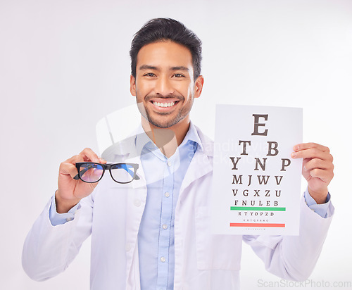 Image of Portrait of doctor holding glasses, eye test and smile at vision clinic, reading assessment and eyesight in India. Healthcare, wellness and happy man optometrist with medical exam for eyes and sight.