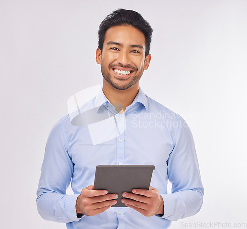Image of Portrait, smile and business man with tablet in studio isolated on a white background. Ceo face, professional boss and happy Asian male entrepreneur from Singapore from with touchscreen technology.