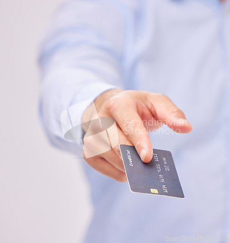 Image of Credit card in hand, payment and shopping with man, purchase product or service isolated on white background. Closeup, commerce and customer, buying with promotion and sale, shop and male in studio