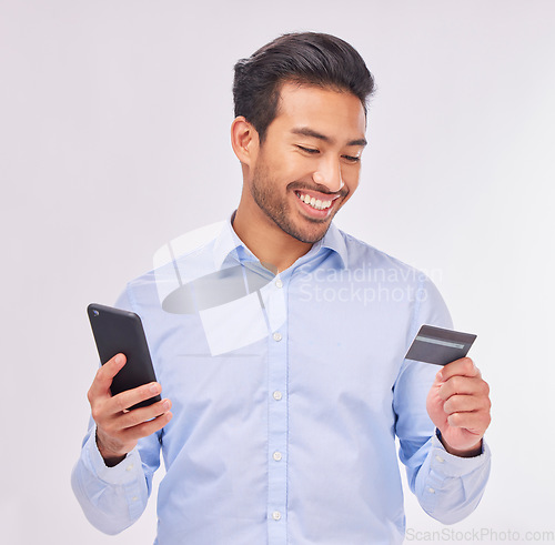 Image of Man with smartphone, credit card and smile for ecommerce, fintech and online shopping isolated on white background. Payment, internet banking and technology with bank app and happy male in studio