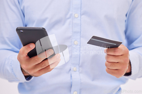 Image of Man, ecommerce with smartphone and credit card in hands, closeup with fintech and online shopping isolated on white background. Payment, internet banking and technology, bank app and male in studio