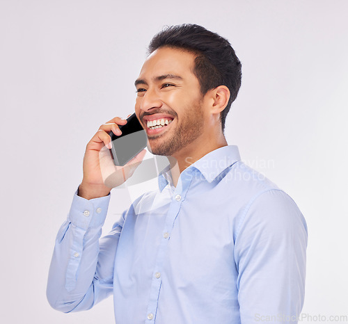 Image of Phone call, smile and business man talking in studio isolated on a white background. Cellphone, communication and happy Asian male professional with mobile for funny discussion, speaking or chatting.