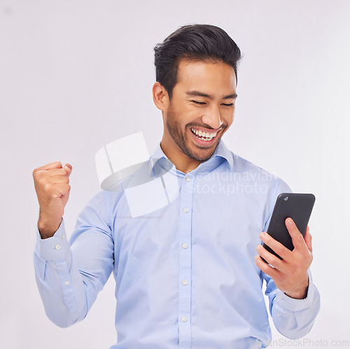 Image of Winner, celebration and business man with phone in studio isolated on a white background. Success, cellphone and happy male professional celebrating, bonus or winning prize, competition or lottery.