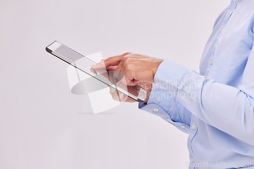 Image of Hands, tablet and business man typing in studio isolated on a white background. Technology, social media and male professional with touch screen for research, web scrolling and internet browsing.