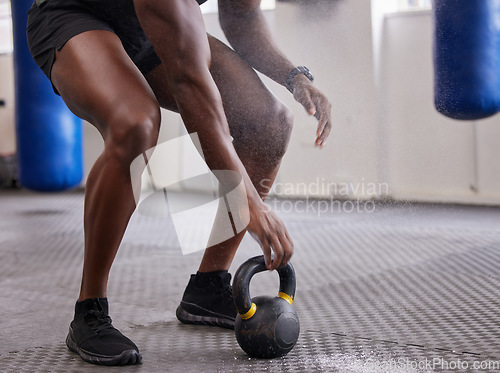 Image of Kettlebell, hands and legs of man training for weightlifting, fitness workout and sports challenge in gym. Closeup bodybuilder holding heavy weights for exercise, power and muscle of strong athlete