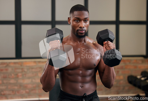 Image of Black man, weight training and fitness of a athlete doing power lifting for exercise at a gym. Sport workout, bodybuilding and African American male with strong arms, wellness and health exercising