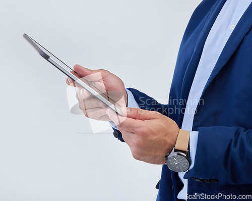 Image of Hands, tablet and man in studio closeup for communication, email or planning schedule by background. Businessman, mobile touchscreen and data analysis on web ux, tech and social network by backdrop