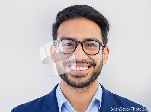 Image of Happy, portrait and excited businessman in studio, smile and confident against a grey background space. Face, happiness and young mexican entrepreneur posing empowered, professional and handsome