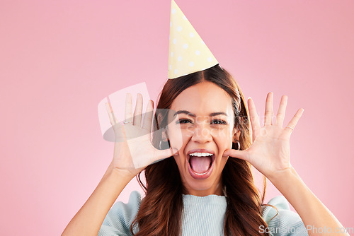 Image of Birthday face portrait, scream and woman excited for happy celebration event, surprise wow or celebrate on pink background. Happiness, party hat and studio female, person or model with crazy energy