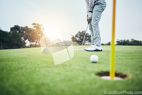 Image of Sports, golf hole and man with golfing club on course ground for game, practice and training for competition. Professional golfer, grass and male athlete hit ball for winning, score or tee stroke