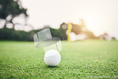 Image of Sports, golf ball and practice on lawn of course for competition match, tournament and training. Target, challenge and games with equipment on grass field for leisure, recreation hobby and club