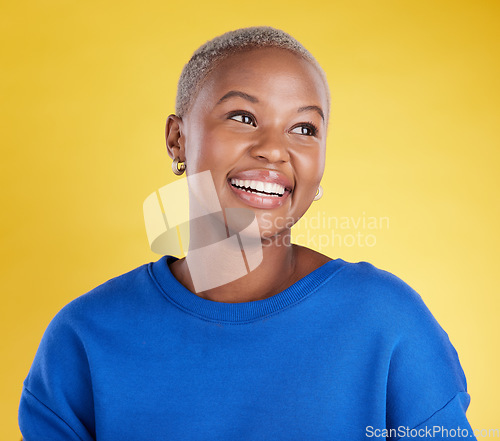 Image of Thinking, smile and a black woman on a yellow background in a studio feeling nostalgic. Face, idea and happy with an attractive young female looking for inspiration while contemplating a thought