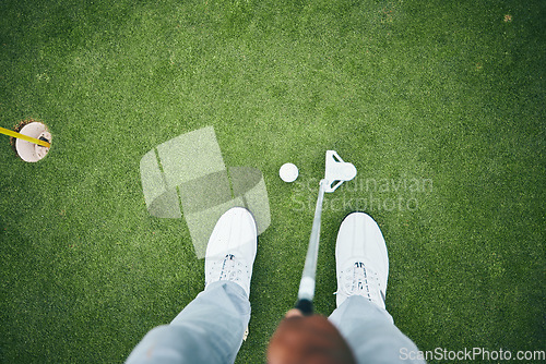 Image of Grass, golf hole and man with club on course for game, practice and training for golfing competition. Professional golfer, sports and top view of male shoes hit ball for winning, score or tee stroke
