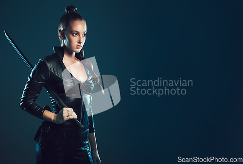 Image of Woman, sword and assassin costume in studio with mock up space for action, movie promo or branding. Girl, blade and mockup for logo, brand and promotion with model ninja, danger and future aesthetic