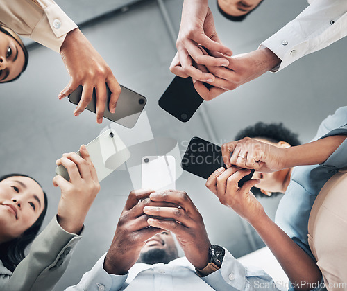 Image of Phone, circle or business people networking on social media searching online news together in low angle. Mobile app technology, digital internet website or group chat community hands typing message