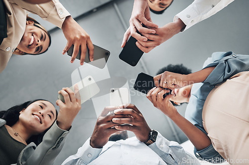 Image of Phone, circle or happy business people networking on social media searching online news together in low angle. Mobile app technology, digital internet website or group chat community hands typing