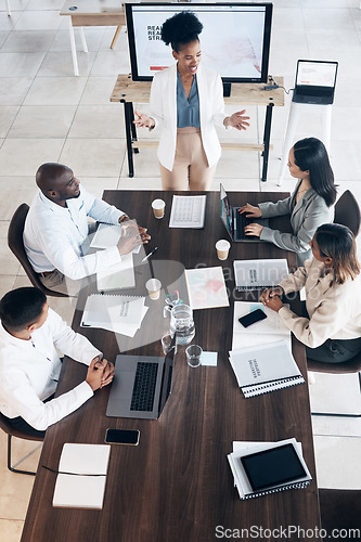 Image of Business meeting, presentation and people above for conference, seminar or workshop in corporate training. Professional black woman, manager or speaker speaking to clients, employees or company staff