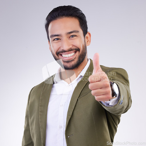 Image of Thumbs up, success and portrait of business man smile and happy for win isolated in a studio white background. Entrepreneur, Latino and corporate employee excited, thank you and agreement sign