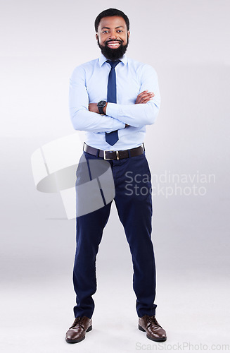 Image of Business, studio portrait and black man smile with arms crossed in leadership, pride and motivation on white background. Happy corporate manager and confidence of management, commitment or proud look